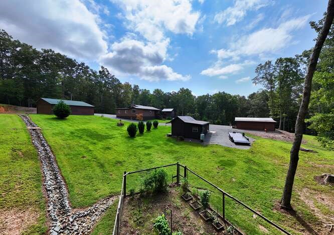 245 Panther Hill Road Murphy, NC 28906 - Photo 10 of 57 a garden view with a seating space