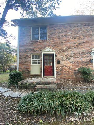 4226 Castleton Road Charlotte, NC 28211 - Photo 11 of 14 a front view of a house with yard and trees around