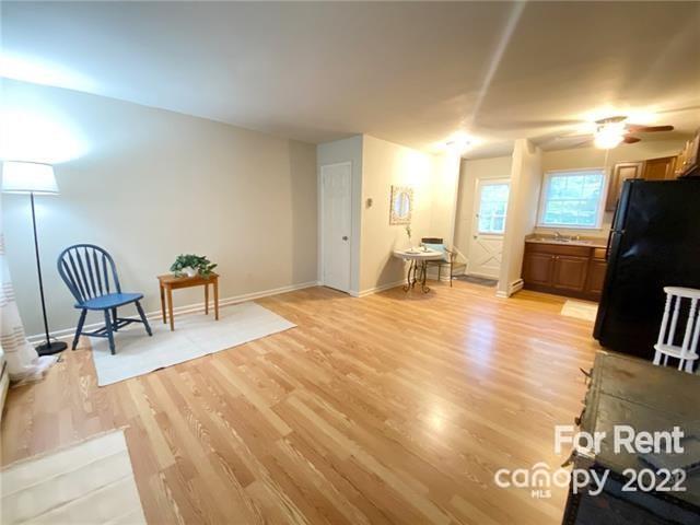 4226 Castleton Road Charlotte, NC 28211 - Photo 4 of 14 a bedroom with a bed and a chair