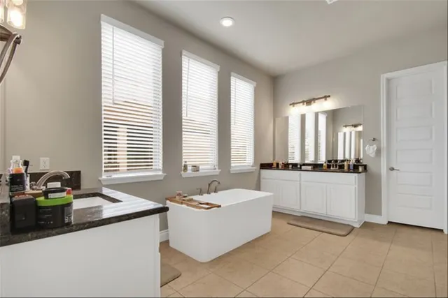 a living room with granite countertop furniture and a sink