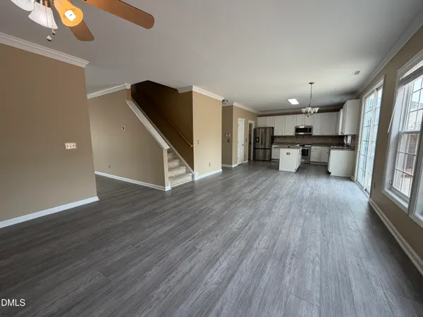 a view of kitchen with furniture and wooden floor