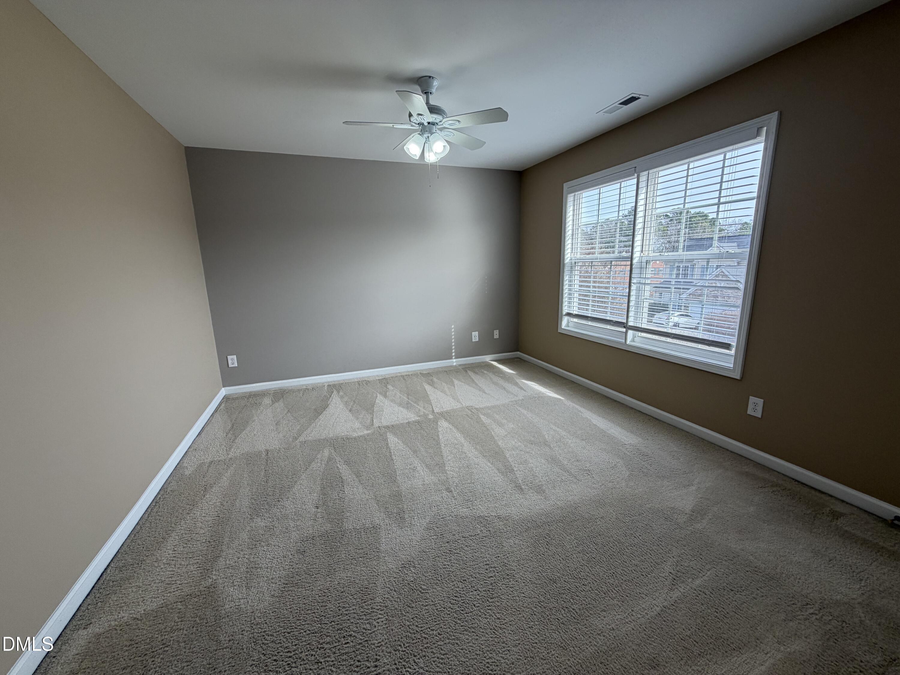 2418 Lazy River Drive Raleigh, NC 27610 - Photo 8 of 14 a view of an empty room with a window