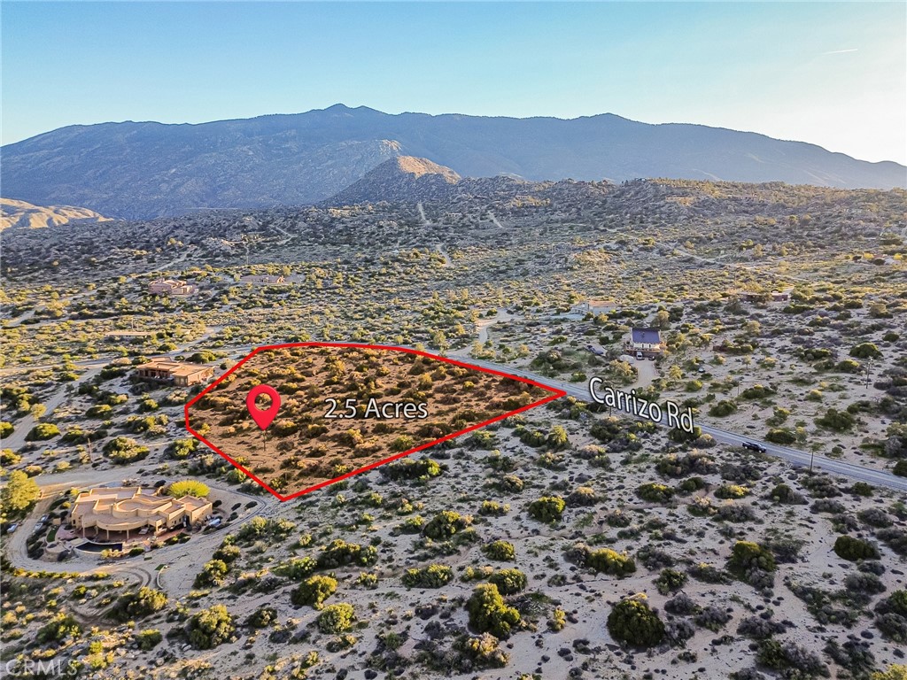 63400 Carrizo Road Mountain Center, CA 92561 - Photo 12 of 42 a view of a lush green hillside and a houses