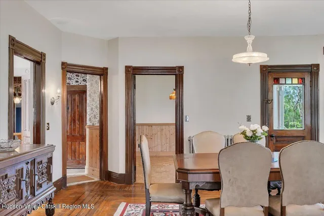 a view of a dining room with furniture window and wooden floor