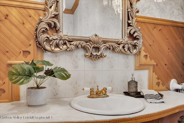 an aerial view of a residential houses with yard