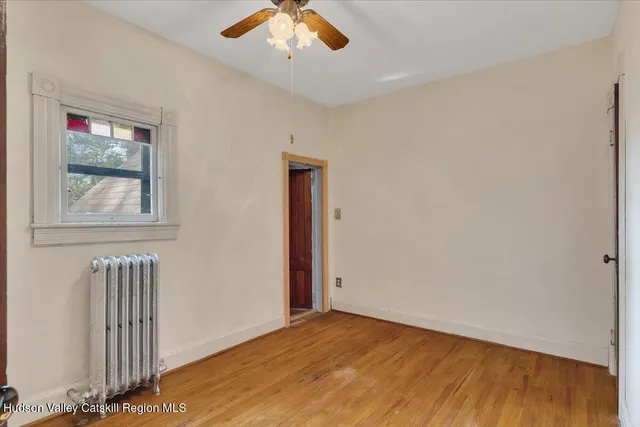 an aerial view of residential house with outdoor space and trees all around