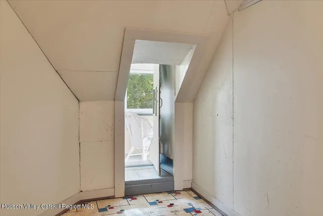 a view of a field with a tree