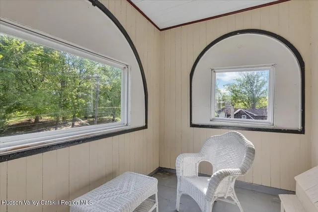 a big yard with lots of green space and fountain