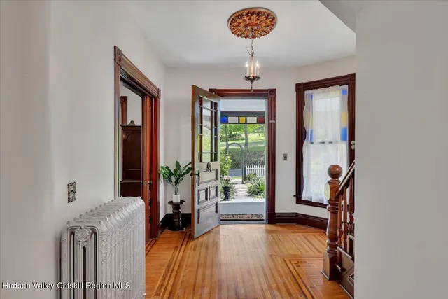 a view of an entryway with a chandelier