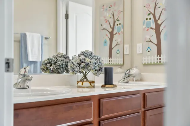 a bedroom with two beds and a window