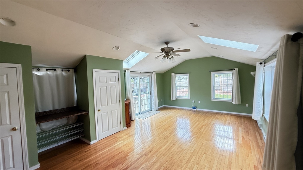 118 Spruce Road Norwood, MA 02062 - Photo 16 of 39 a view of a hallway with wooden floor and closet