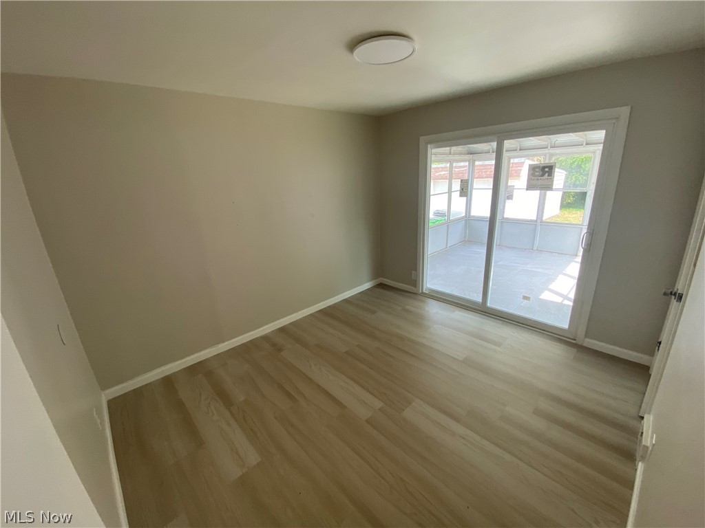 13117 Silver Road Garfield Heights, OH 44125 - Photo 13 of 20 Spare room with light wood-type flooring