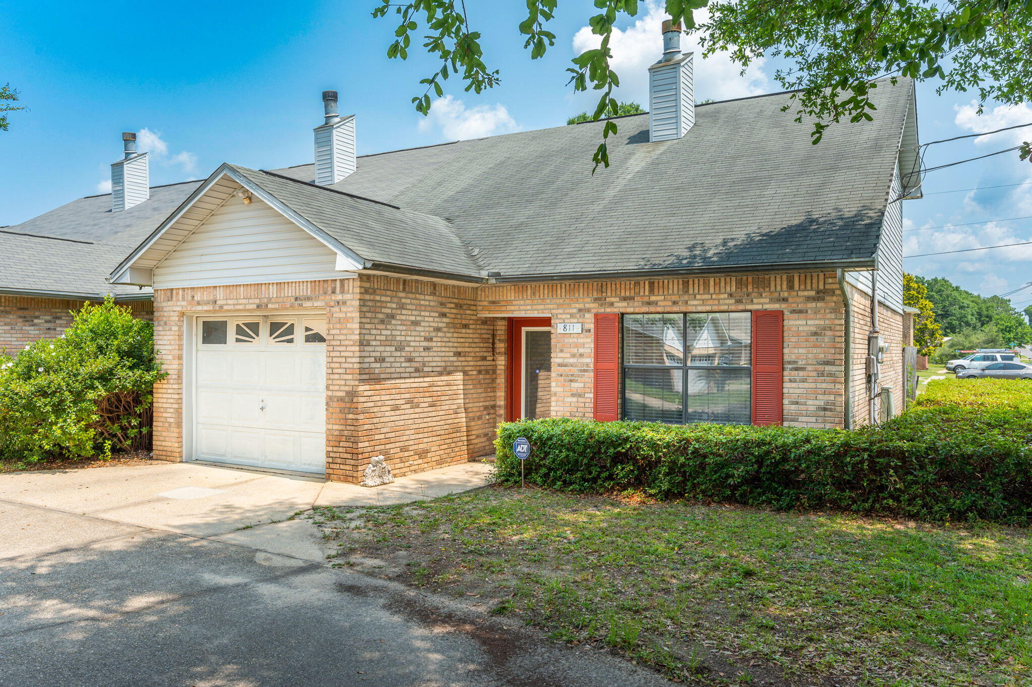 811 Valley Road Crestview, FL 32539 - Photo 1 of 26 a front view of a house with a garden