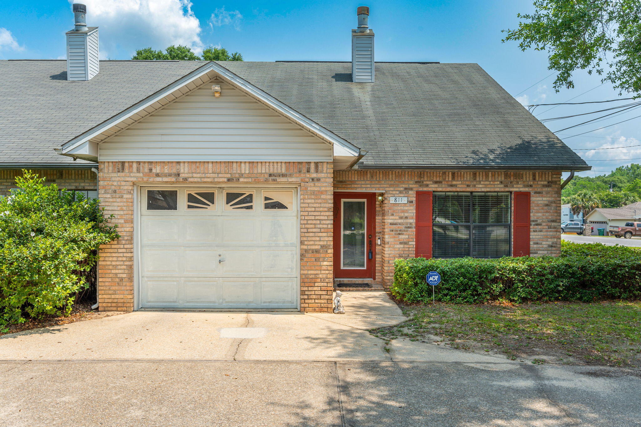 811 Valley Road Crestview, FL 32539 - Photo 2 of 26 a front view of a house with a garden