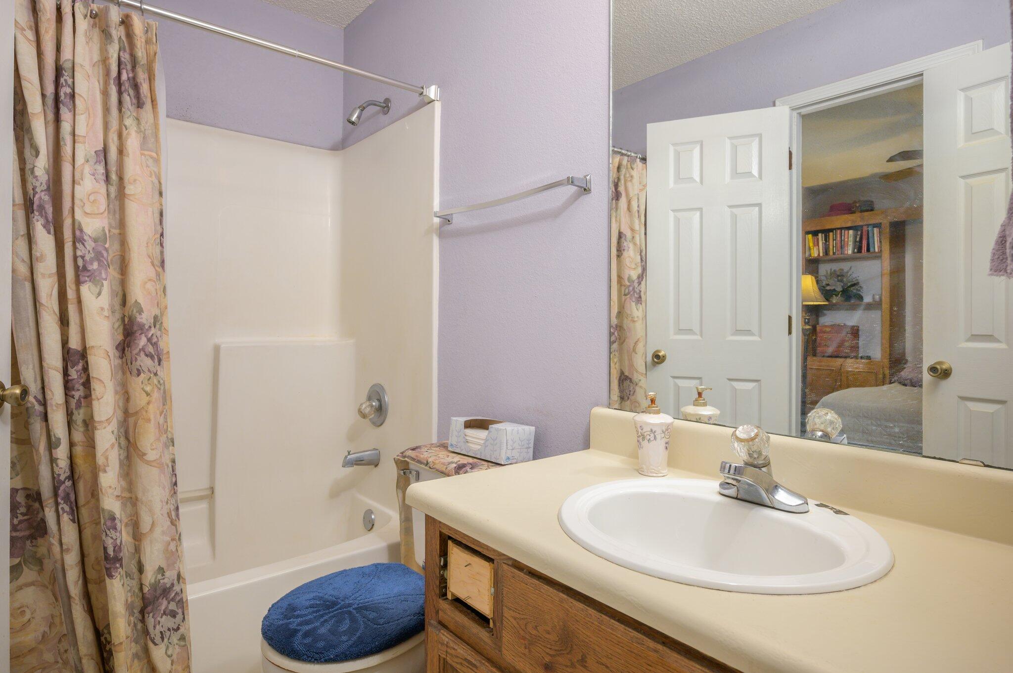 811 Valley Road Crestview, FL 32539 - Photo 22 of 26 a bathroom with a sink toilet and shower
