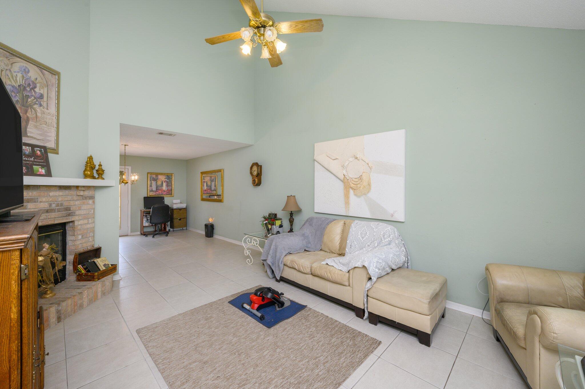 811 Valley Road Crestview, FL 32539 - Photo 5 of 26 a living room with furniture and a fireplace