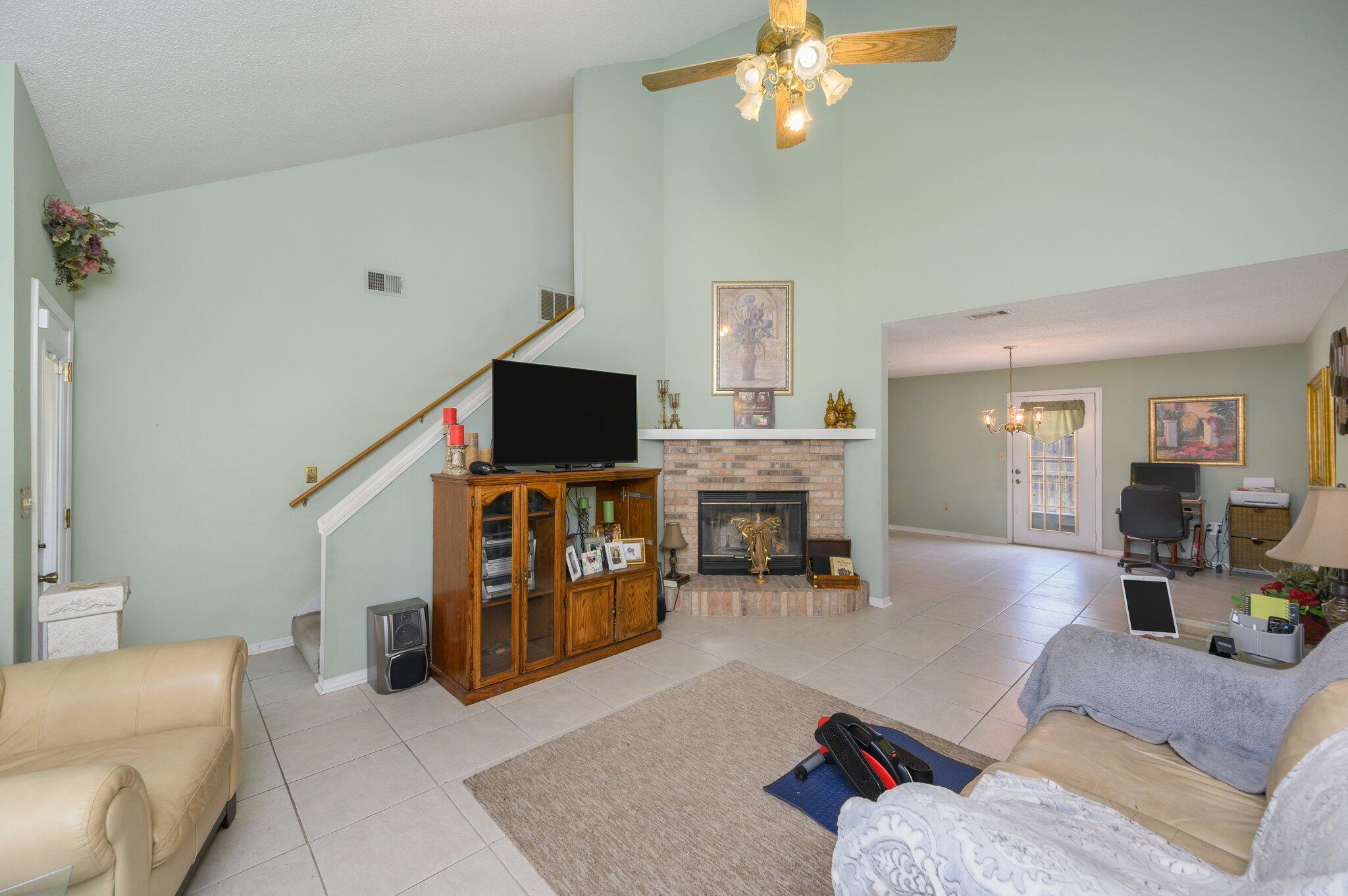 811 Valley Road Crestview, FL 32539 - Photo 6 of 26 a living room with furniture and a fireplace