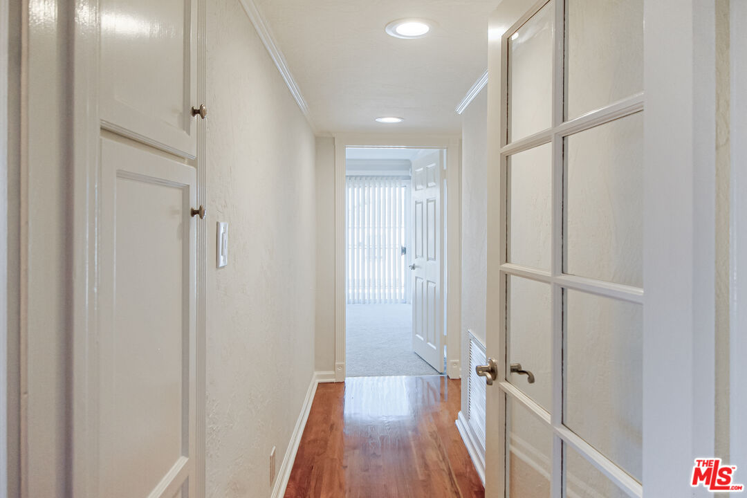 930 South Bedford Street, Unit 4 Los Angeles, CA 90035 - Photo 13 of 24 a view of a bathroom with a tub and shower