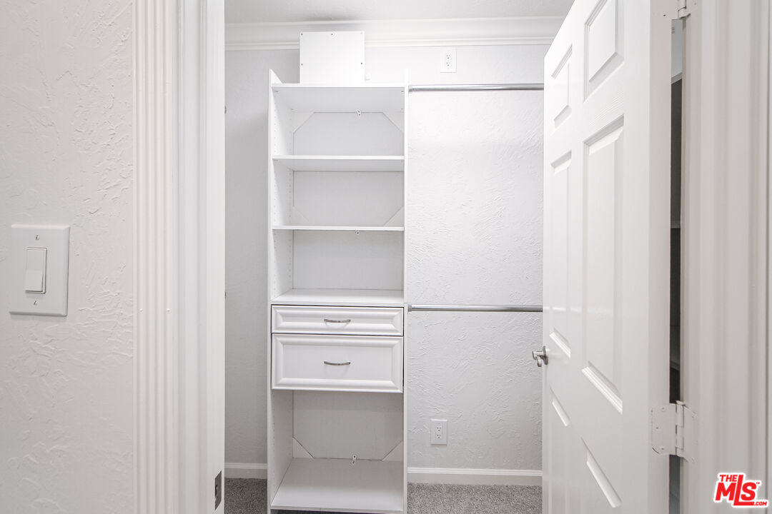 930 South Bedford Street, Unit 4 Los Angeles, CA 90035 - Photo 16 of 24 a view of walk in closet with empty racks