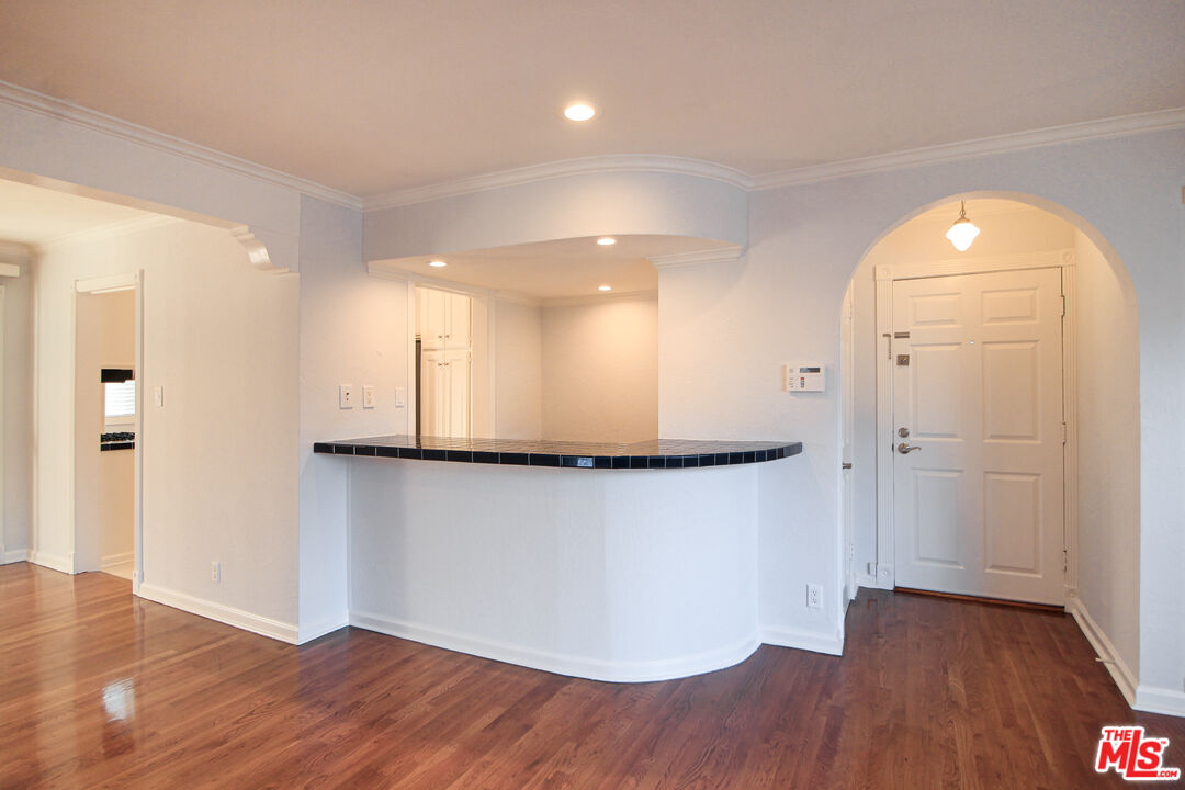 930 South Bedford Street, Unit 4 Los Angeles, CA 90035 - Photo 17 of 24 a view of a kitchen with a dishwasher and wooden floor