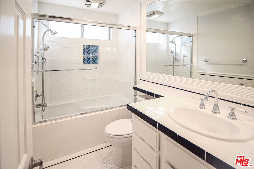 930 South Bedford Street, Unit 4 Los Angeles, CA 90035 - Photo 21 of 24 a bathroom with a sink toilet and shower