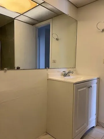 a bathroom with a sink and mirror