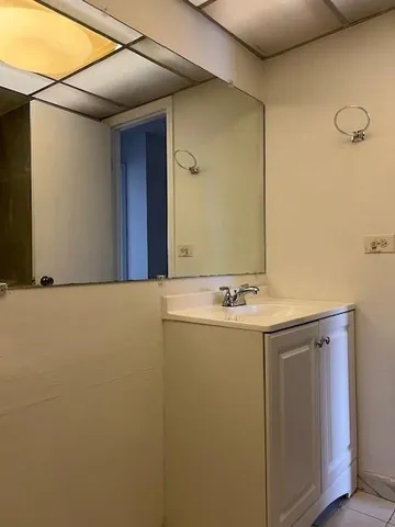 a bathroom with a sink and mirror
