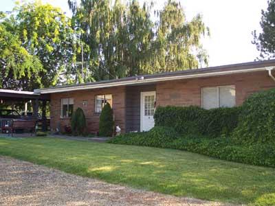 113 Sand Hill Road Grandview, WA 98930 - Photo 2 of 24 a view of a house with a yard