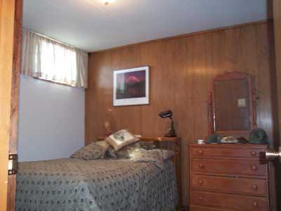 113 Sand Hill Road Grandview, WA 98930 - Photo 13 of 24 a bedroom with a bed and a dresser