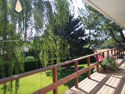 113 Sand Hill Road Grandview, WA 98930 - Photo 17 of 24 a view of balcony with wooden floor and seating space