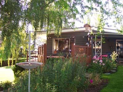 113 Sand Hill Road Grandview, WA 98930 - Photo 5 of 24 a view of a chairs and table in a backyard of the house