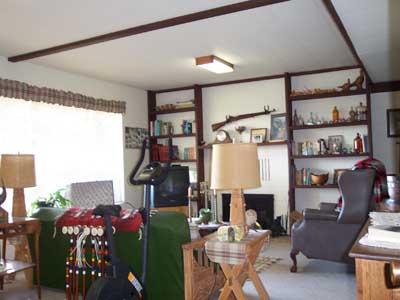 113 Sand Hill Road Grandview, WA 98930 - Photo 9 of 24 a living room with furniture and a floor to ceiling window