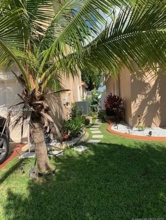 a house view with a garden space