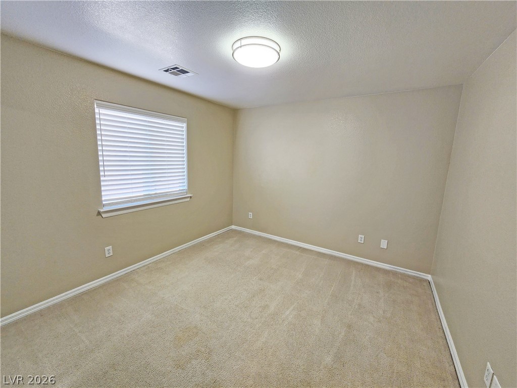 4591 Stoneham Street Pahrump, NV 89061 - Photo 32 of 42 A well-lit room offers comfort and potential for diverse living arrangements.