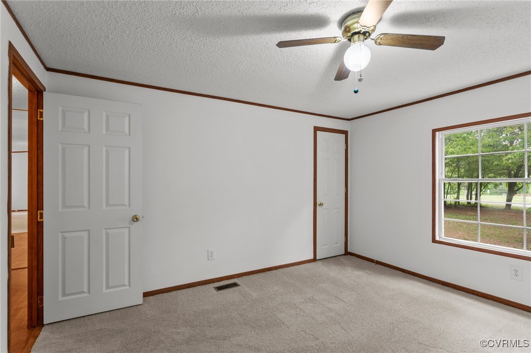 55 Redd Shop Road Farmville, VA 23901 - Photo 28 of 37 a view of a livingroom with a ceiling fan and window