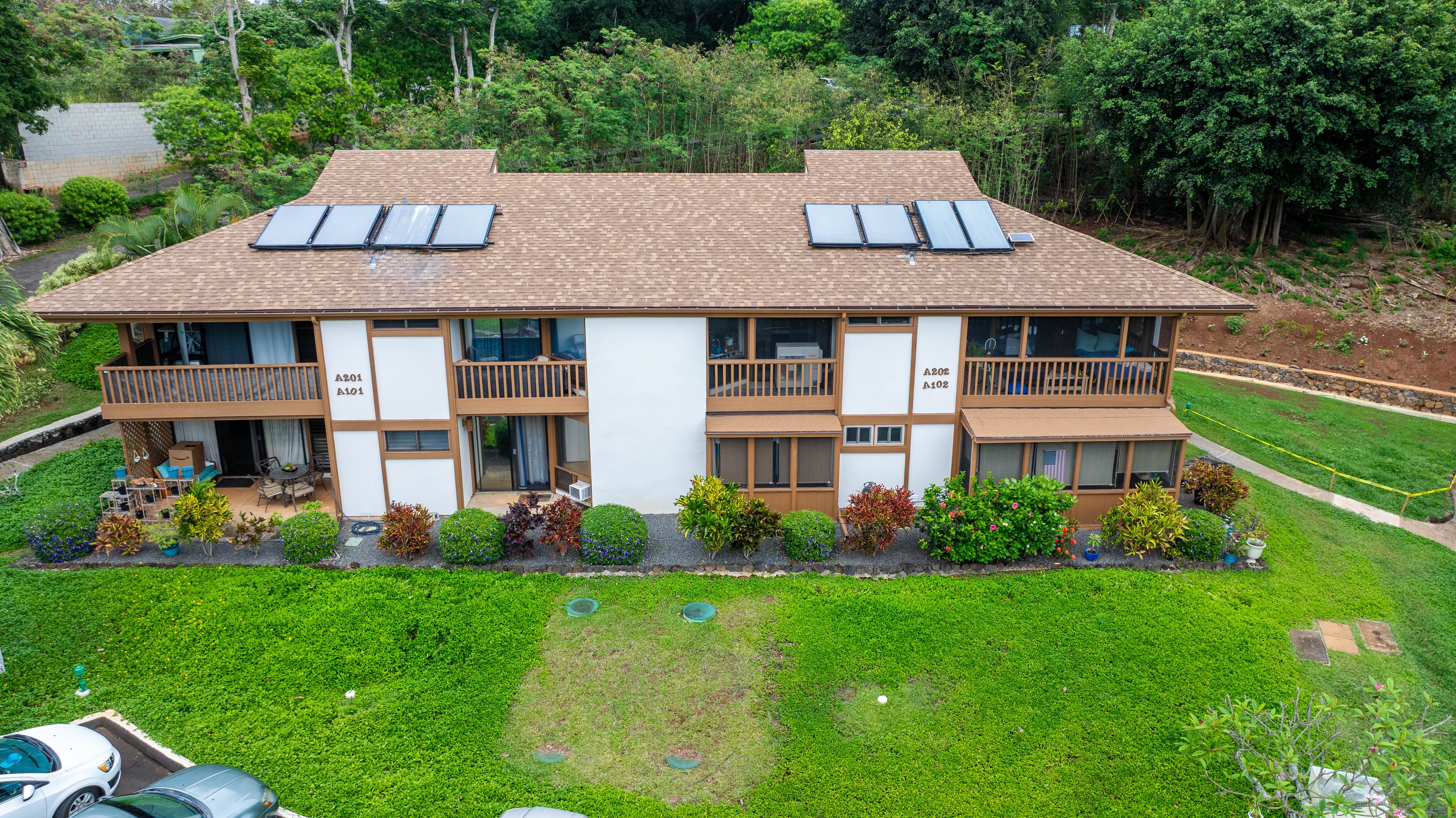 4701 Kawaihau Road, Unit A101 Kapaa, HI 96746 - Photo 15 of 25 a front view of a house with garden