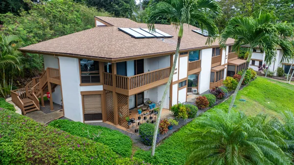 a aerial view of a house with yard and sitting area