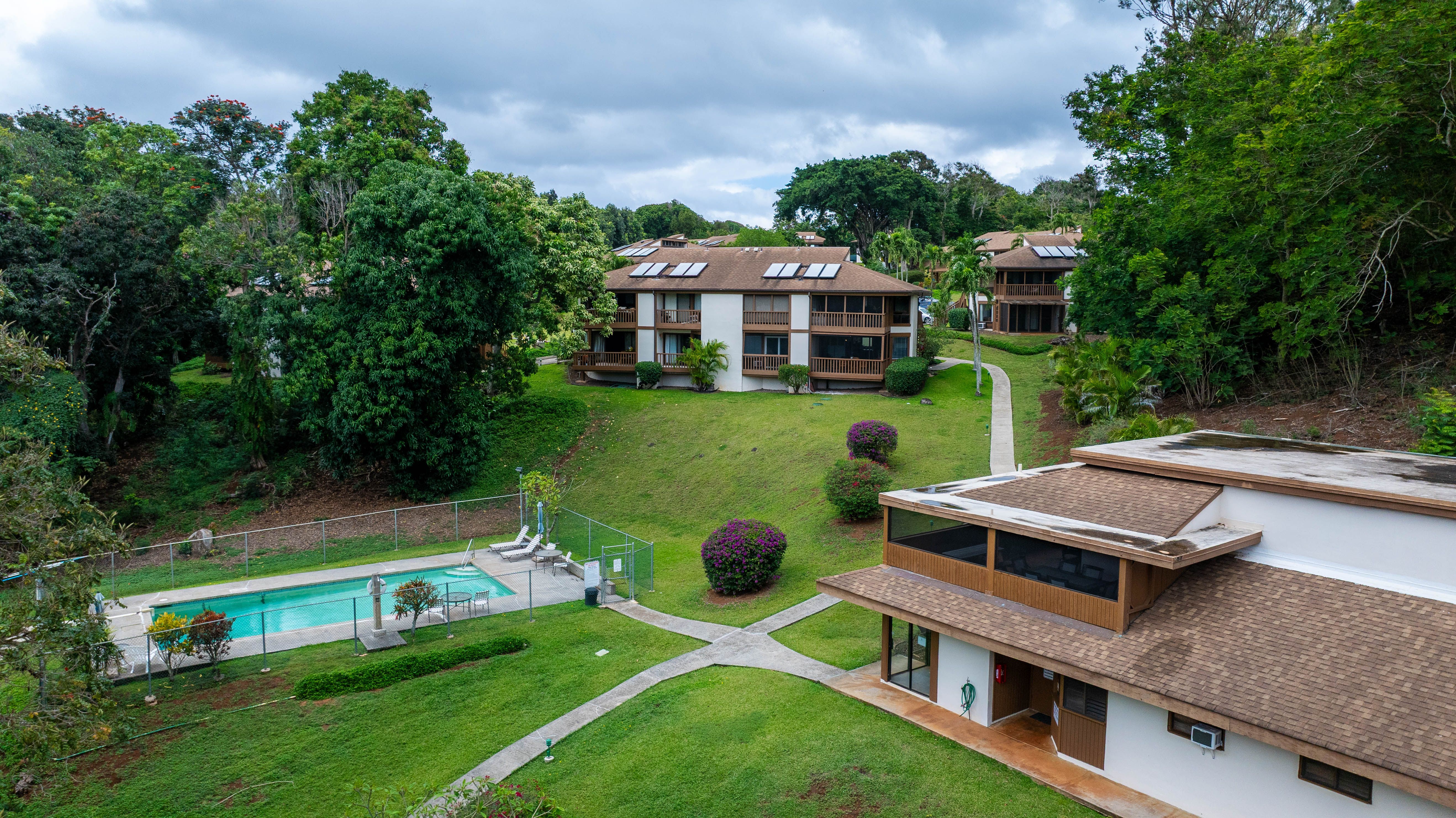 4701 Kawaihau Road, Unit A101 Kapaa, HI 96746 - Photo 21 of 25 an aerial view of a house with backyard space and balcony