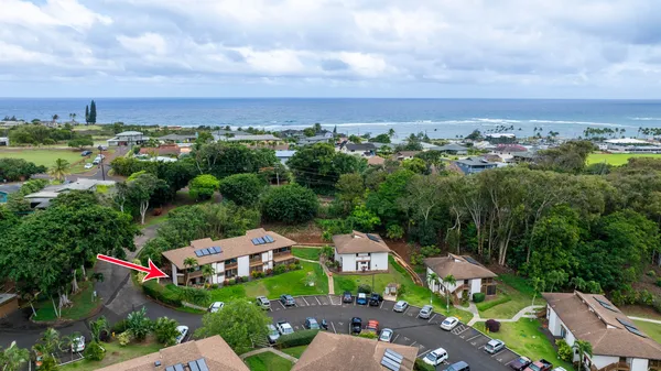 an aerial view of a house with lots of trees