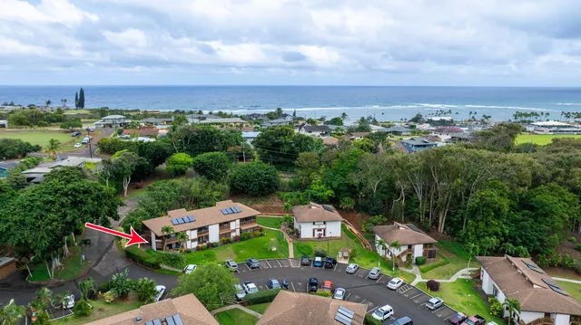 an aerial view of a house with lots of trees