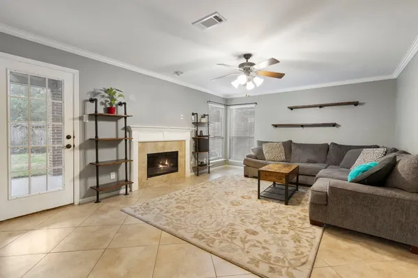 a living room with furniture and a fireplace
