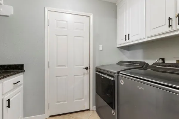 a close view of a stove top oven and cabinets