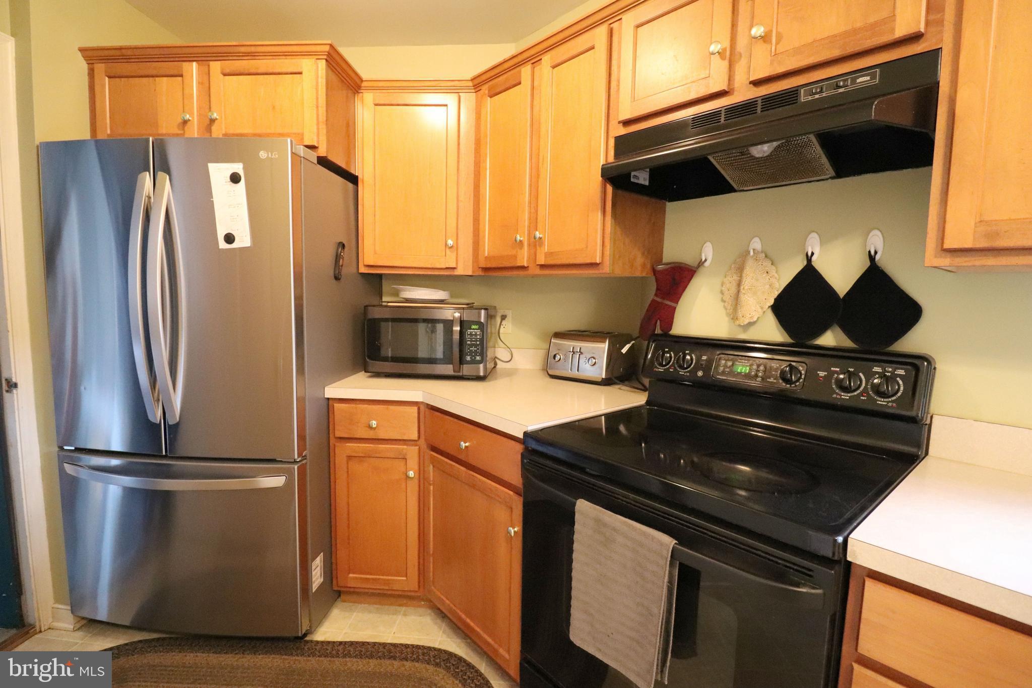 641 Chickadee Drive Lititz, PA 17543 - Photo 12 of 42 a kitchen with a stove and a refrigerator