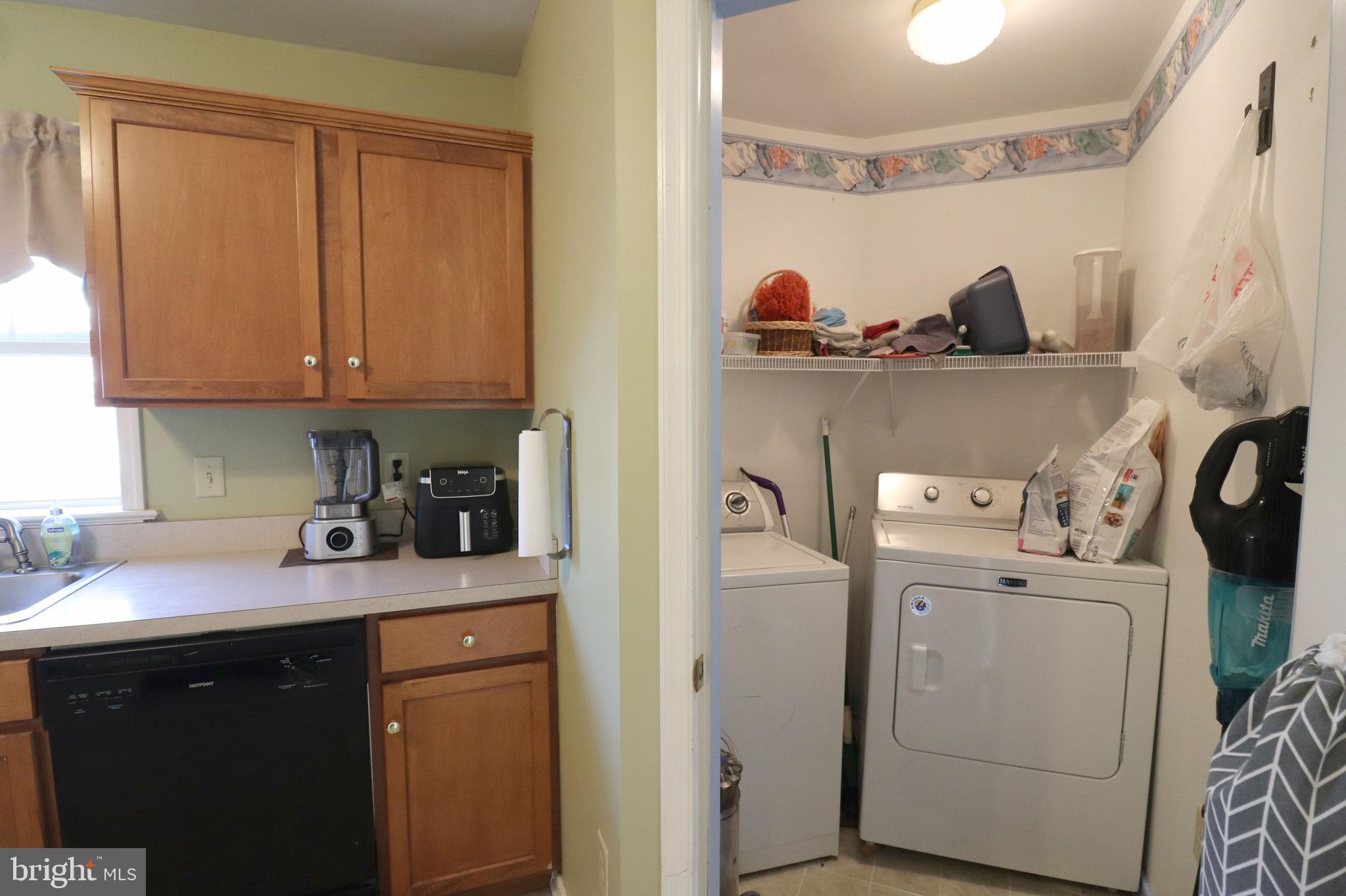 641 Chickadee Drive Lititz, PA 17543 - Photo 14 of 42 a kitchen with refrigerator and cabinets