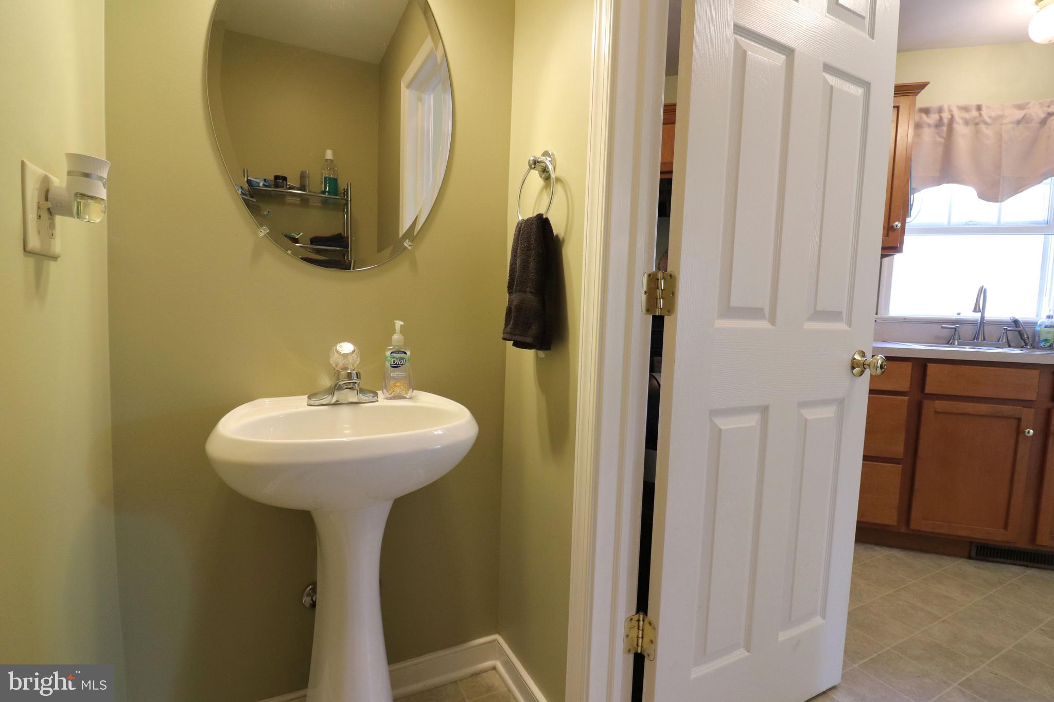 641 Chickadee Drive Lititz, PA 17543 - Photo 15 of 42 a bathroom with a sink a mirror and shower