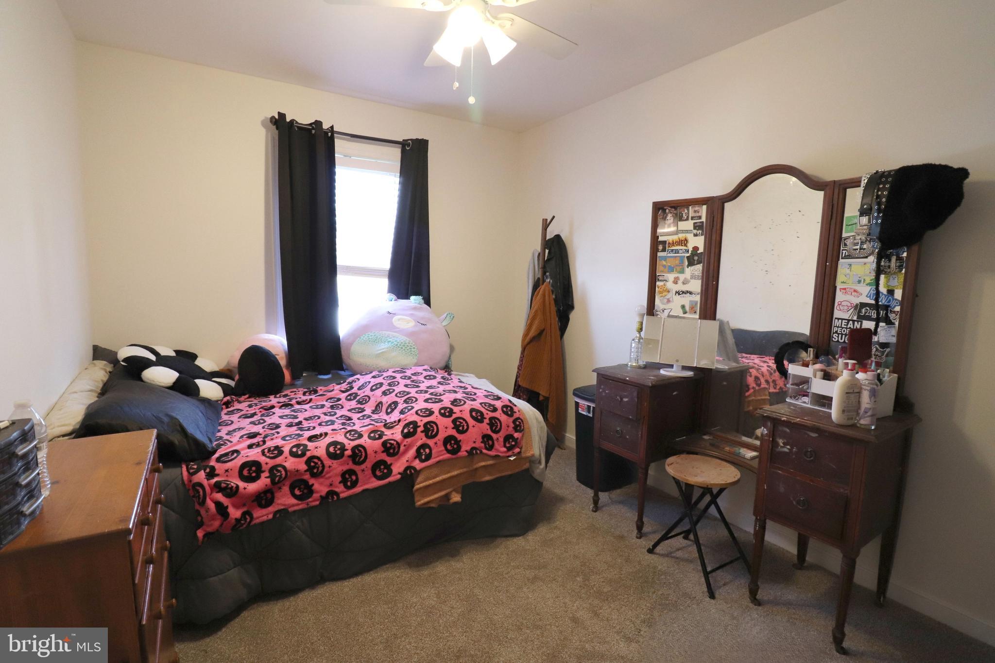 641 Chickadee Drive Lititz, PA 17543 - Photo 23 of 42 a bedroom with a bed and a mirror