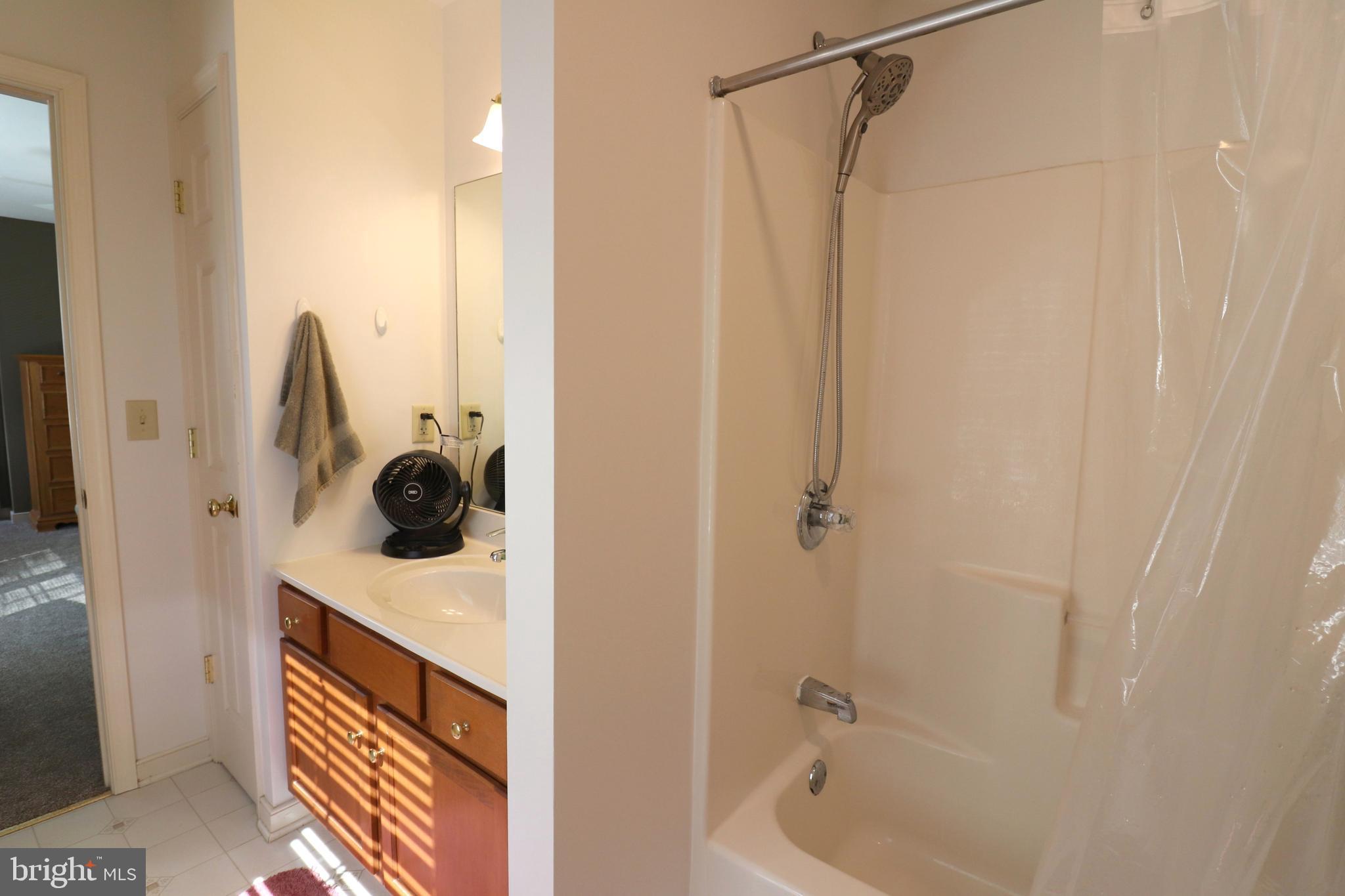 641 Chickadee Drive Lititz, PA 17543 - Photo 28 of 42 a bathroom with a shower and mirror