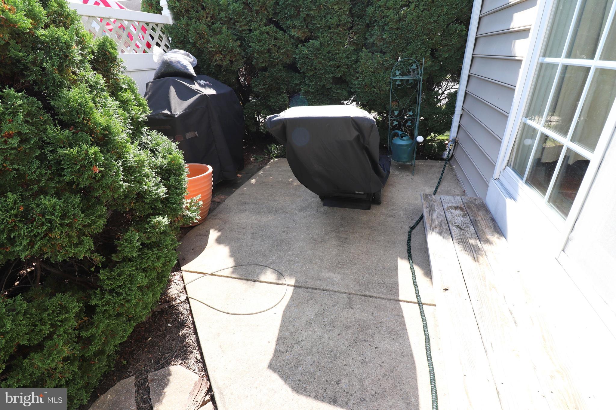 641 Chickadee Drive Lititz, PA 17543 - Photo 32 of 42 a view of a chair and table in backyard