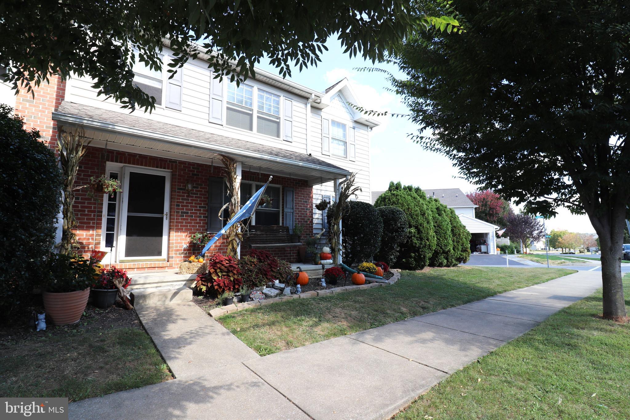 641 Chickadee Drive Lititz, PA 17543 - Photo 34 of 42 a view of a house with backyard fire pit and tree