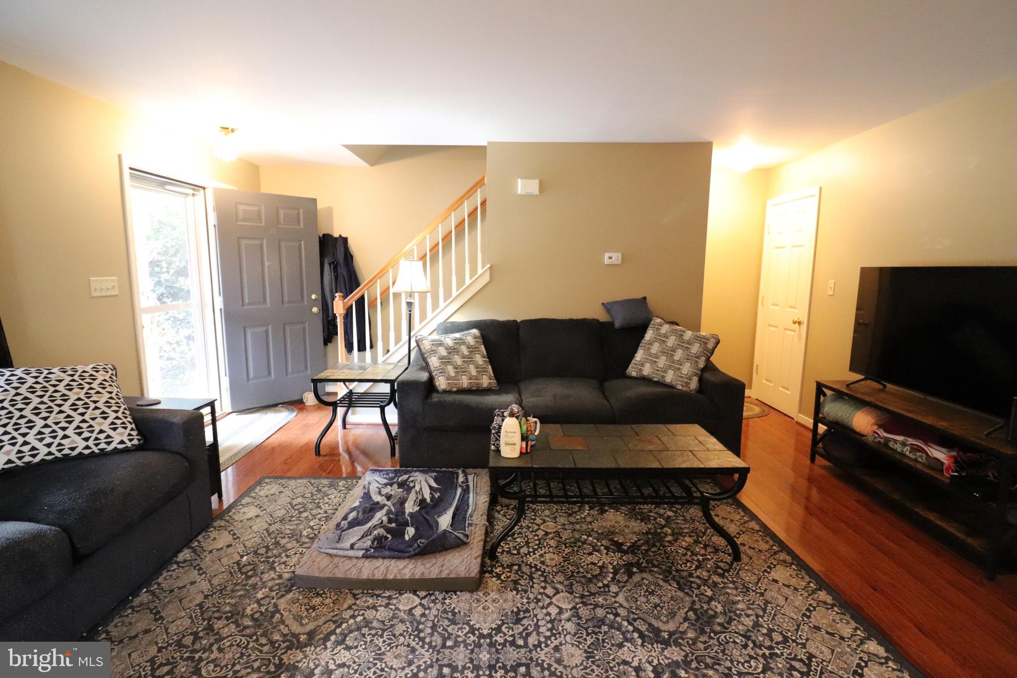 641 Chickadee Drive Lititz, PA 17543 - Photo 4 of 42 a living room with furniture and a flat screen tv